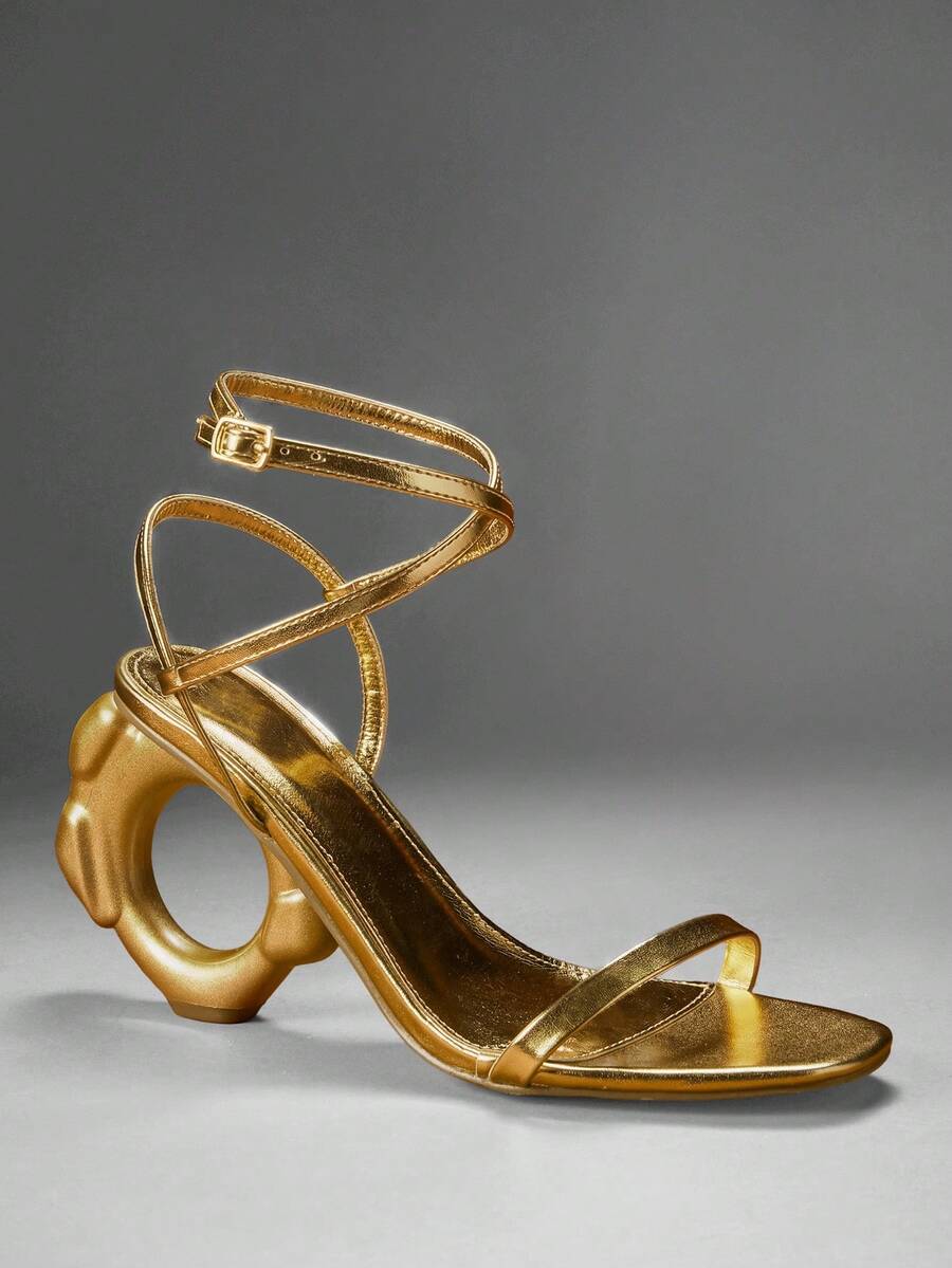 Gold square open toe ankle strap sandals with circular sculptural heel