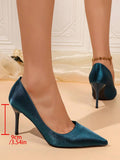 Peacock blue court pump with low-cut vamp and slim stiletto heel