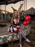 Horror clown cosplay costume in abandoned carnival setting with red black balloons