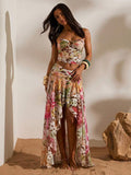 Front full view of multicolor tropical print mesh bandeau crop top and flowing high-slit maxi skirt two-piece set for beach vacation styling
