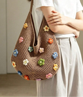 Full shoulder view of large floral crochet bag for daily essentials