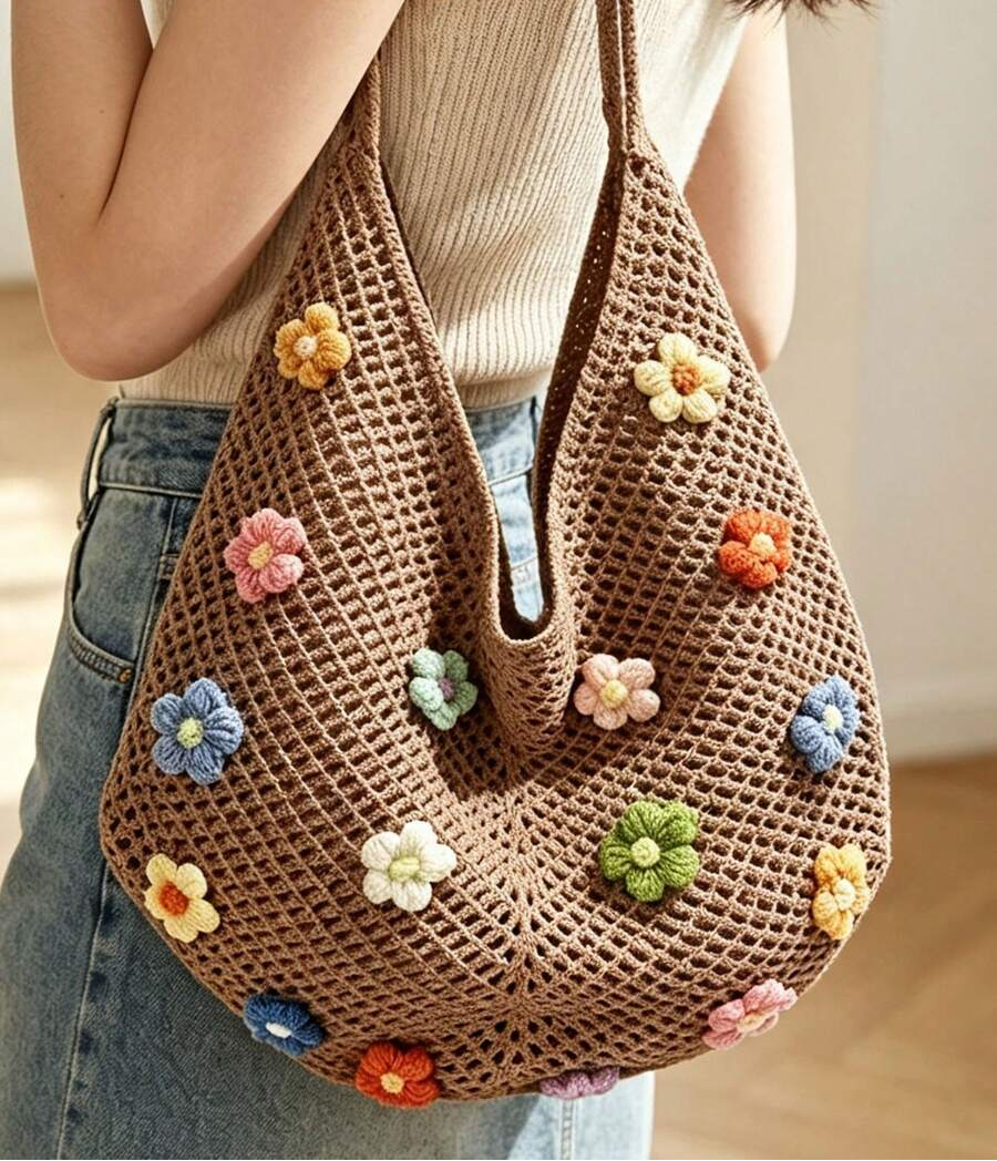 Close shoulder view of coffee brown crochet flower tote bag with openwork texture