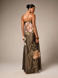 Back view of army green floral embroidered maxi gown with bare shoulders