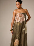 Close view of army green satin bodice and oversized pale rose embroidery
