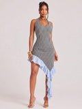 Front view of black and white gingham halter mini dress with scoop neck and asymmetrical ruffle hem