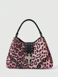 Full view of large burgundy patterned punk shoulder bag with silver cross hardware
