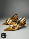Three-quarter pair view of metallic gold open-toe mule sandals with wide vamp and hollow circular sculptural heel