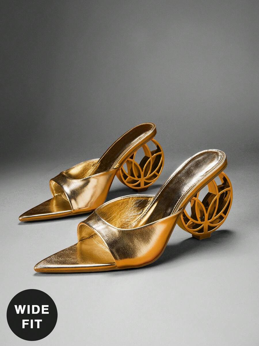 Three-quarter pair view of metallic gold open-toe mule sandals with wide vamp and hollow circular sculptural heel