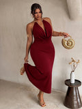 Front view of burgundy plus size halter maxi dress with gold collar and draped neckline