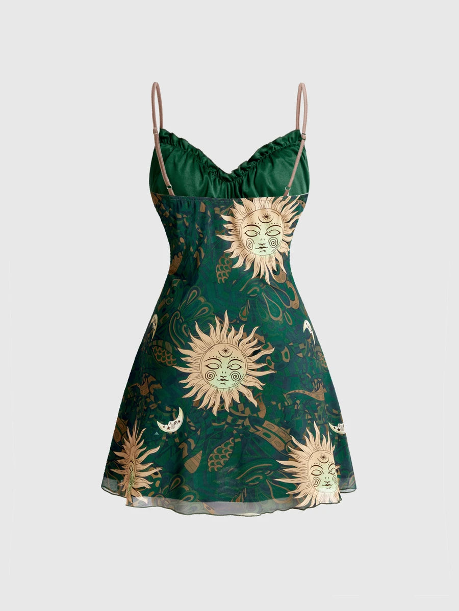 Front view of green celestial sun and moon print cami mini dress with ruched sweetheart bust