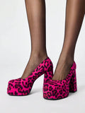 Close-up of hot pink leopard print court pumps with high platform soles