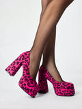 Side view of hot pink leopard print platform pumps with block heels