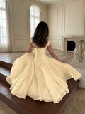 Back View of pale yellow colorblock A-line midi dress with cap sleeves for wedding guest styling