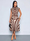 Close-up front view of khaki and white zebra print belted midi dress with zebra print, buckle belt and long waist tie