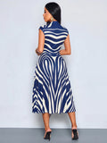 Back view of navy blue and white zebra print belted midi dress with sleeveless A-line silhouette and back zipper
