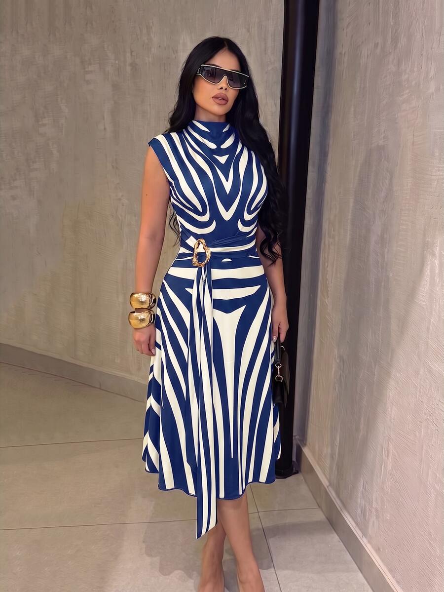 Front view of navy blue and white zebra print belted midi dress with stand collar and gold-tone buckle belt