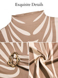 Close-up detail view of apricot and white zebra print belted midi dress with stand collar, gold-tone buckle and zebra fabric