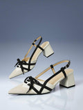 Mustard yellow and black colorblock pointed toe slingback pump