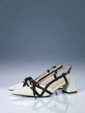 White and black colorblock pointed toe slingback pump