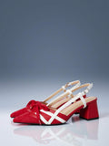 Red and white pointed toe pump with buckle slingback strap