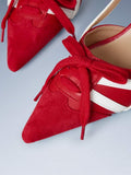 Red lace-up slingback pump showing textured toe panel