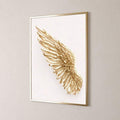 Minimalist angel wing canvas pair in a bright bedroom