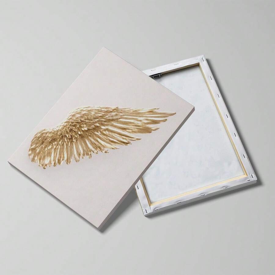 Metallic gold angel wing canvas print in a modern living room