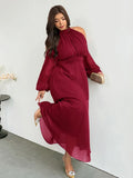 Angled front view of ruby red plus size halter cold-shoulder maxi dress