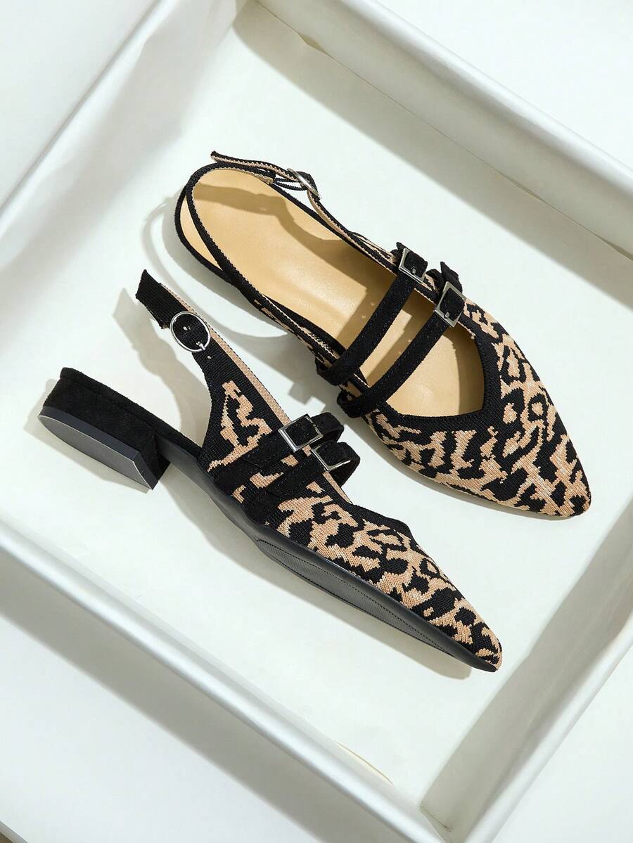 Top view of leopard print slingback flats showing double buckle straps and pointed toes