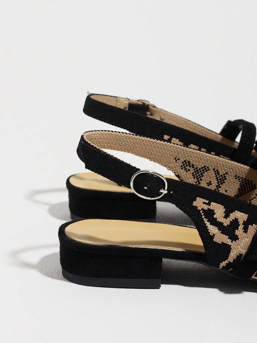 Side heel view of leopard print slingback flats with adjustable back strap and low block heel