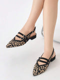 Worn view of leopard print pointed toe slingback flats with low block heels