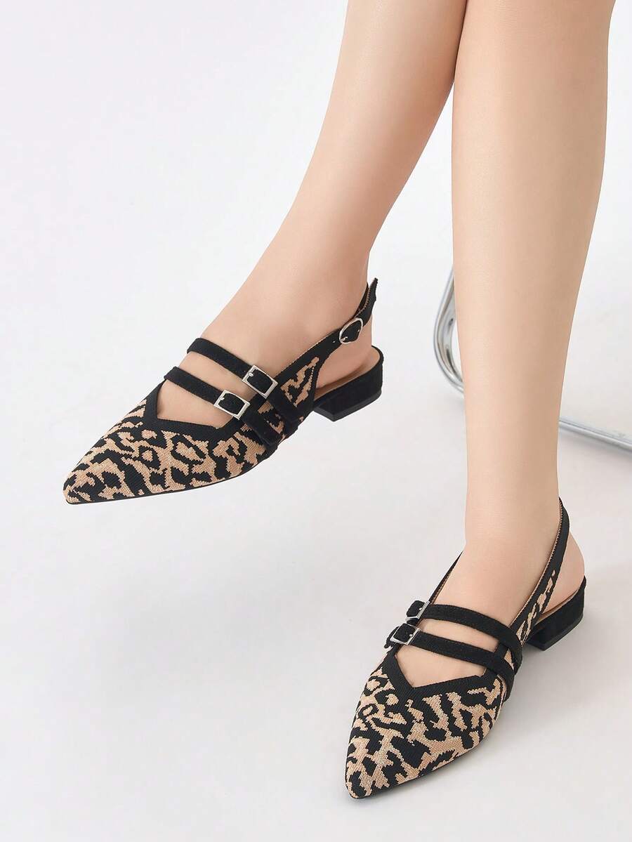 Worn view of leopard print pointed toe slingback flats with low block heels
