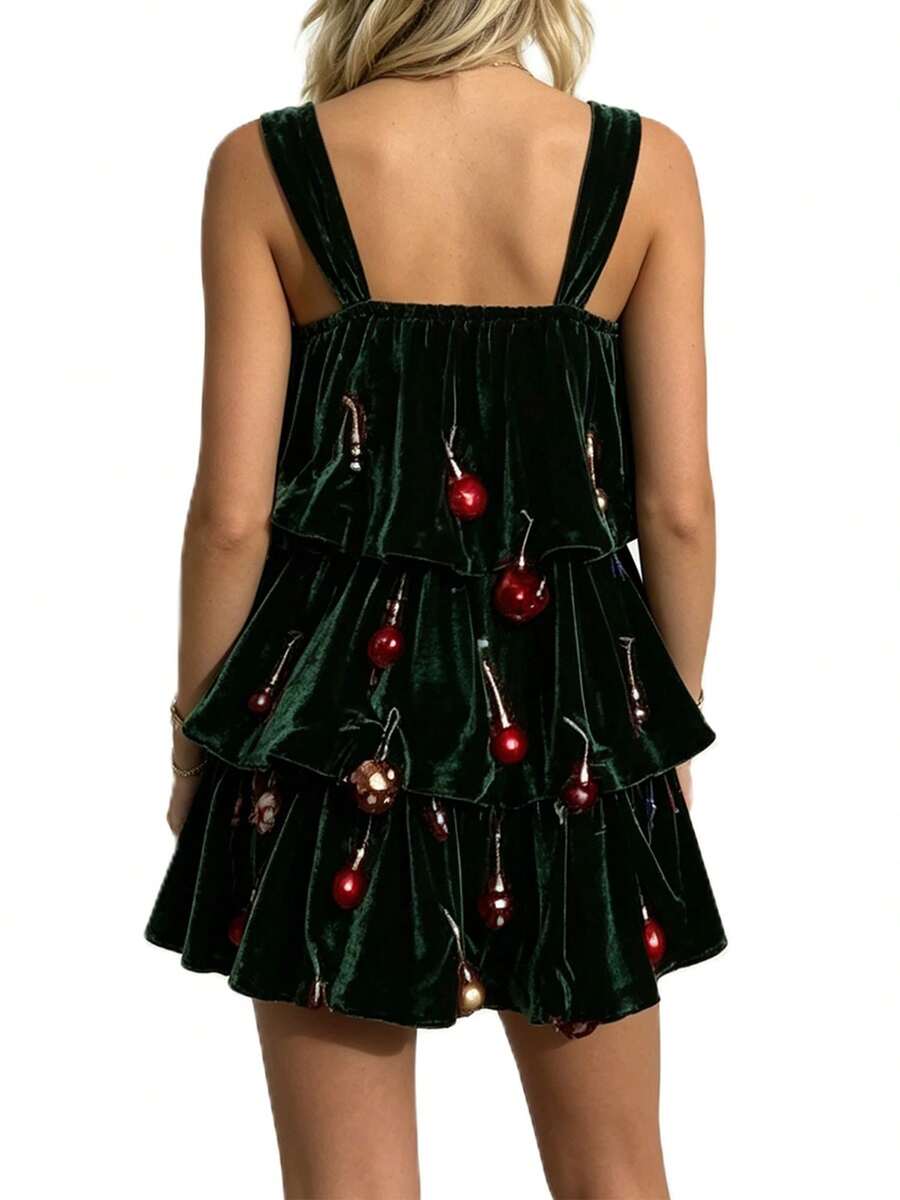 Front view of green Christmas tree costume mini dress with tiered ruffles and bell trim