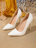 pair display of white pointed-toe stiletto pumps for evening styling