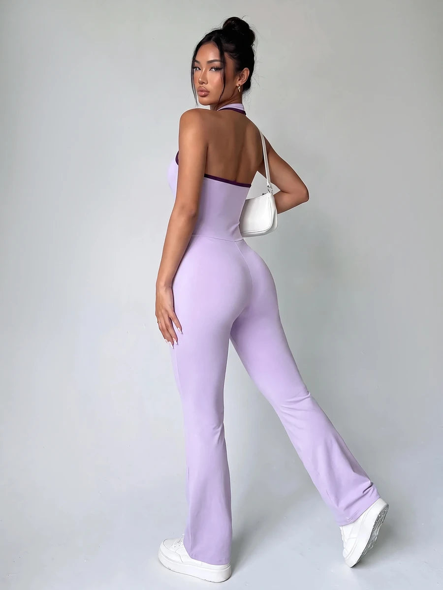 Back view showing the open racerback and long flared legs of lavender unitard