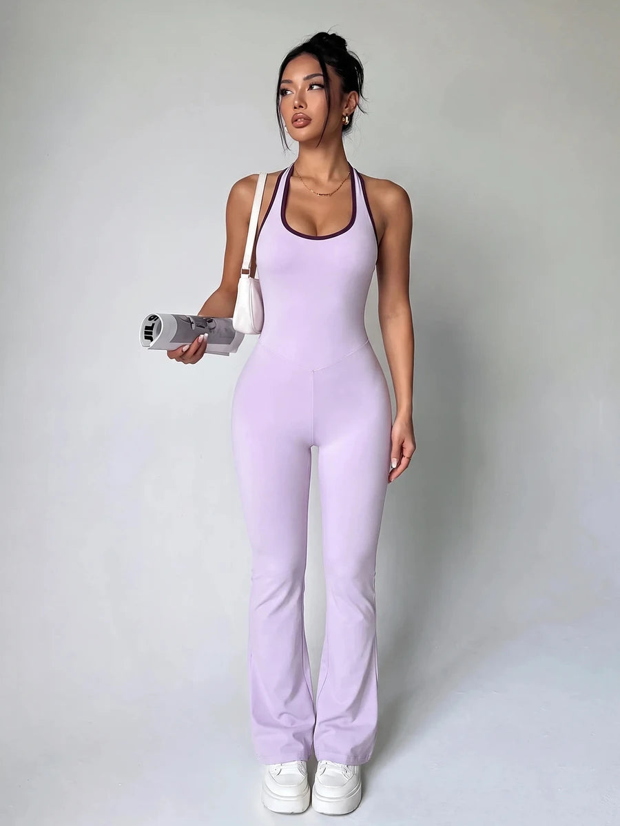 Front view of lavender racerback flare-leg workout jumpsuit with plum trim