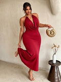 Front view of red plus size halter maxi dress with gold collar and draped neckline