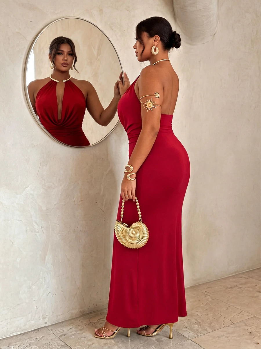 Side back view of red backless halter maxi dress with fitted long skirt