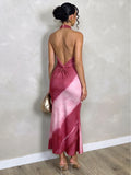 Back view of pink burgundy tie-dye halter dress with V-shaped open back