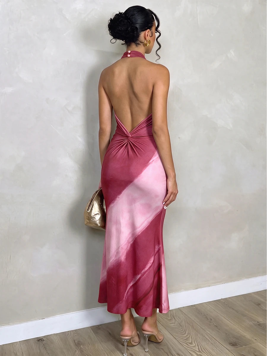 Back view of pink burgundy tie-dye halter dress with V-shaped open back