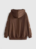 Back view of coffee brown oversized zip-up hoodie with graphic sleeve print