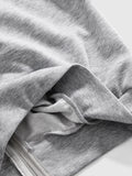 Close view of grey hoodie ribbed cuff, hem and soft knit interior
