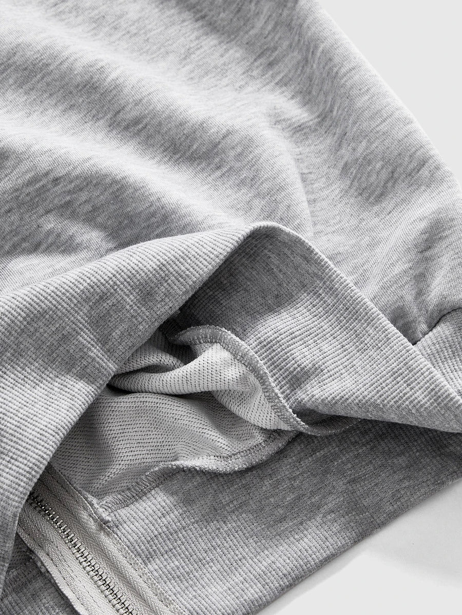 Close view of grey hoodie ribbed cuff, hem and soft knit interior