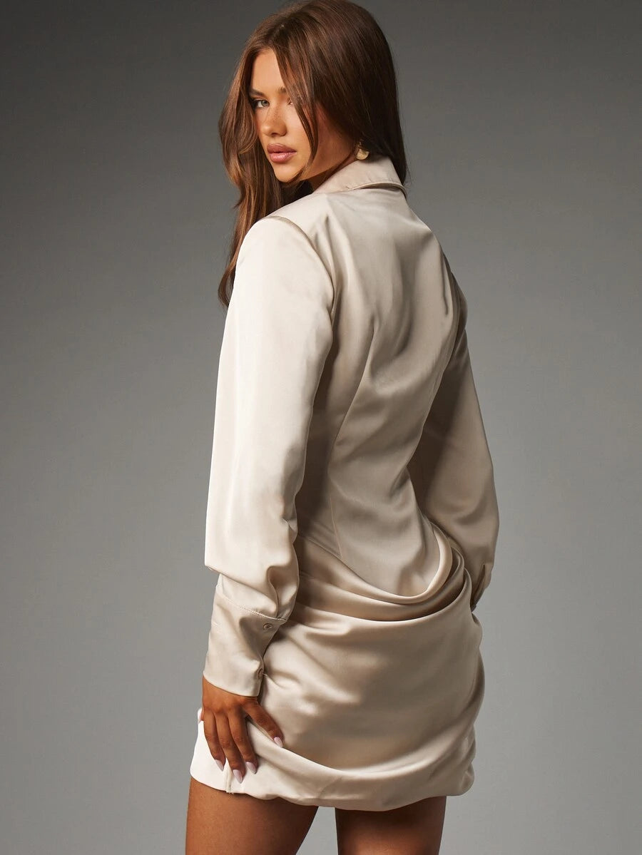 Front full-length view of model wearing champagne-apricot satin shirt mini dress with collar and ruched pencil skirt