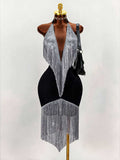 Front mannequin view of black halter cocktail dress with silver fringe bodice and asymmetric fringe hem