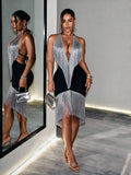 Front and side view of black silver fringe halter cocktail dress with open back