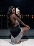 Back view of black and silver fringe halter midi dress with open tie-back