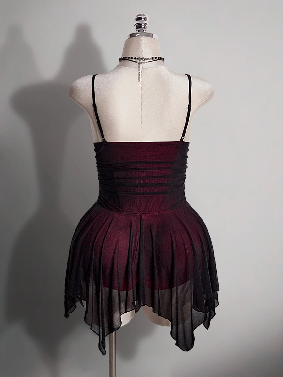 Back view of burgundy and black spaghetti strap gothic mini dress with layered mesh fairy hem