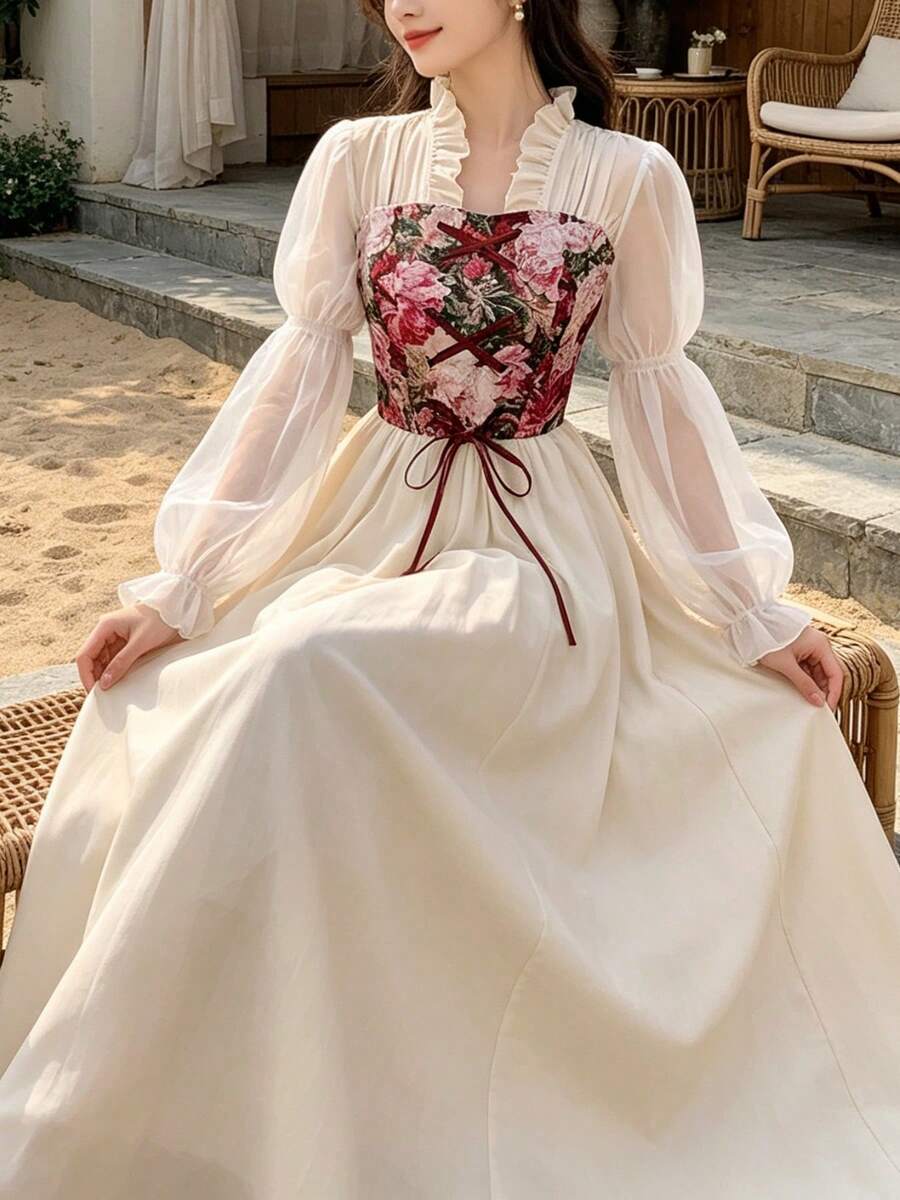 Seated view of apricot floral cottagecore maxi dress with ribbon lacing