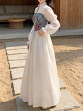 Side view of blue floral corset maxi dress with bishop sleeves